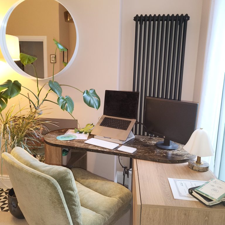 A calm desk set up for online therapy sessions over Google Meet